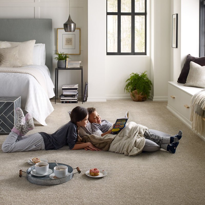 children reading on the floor - Couture Floors in Boerne, TX